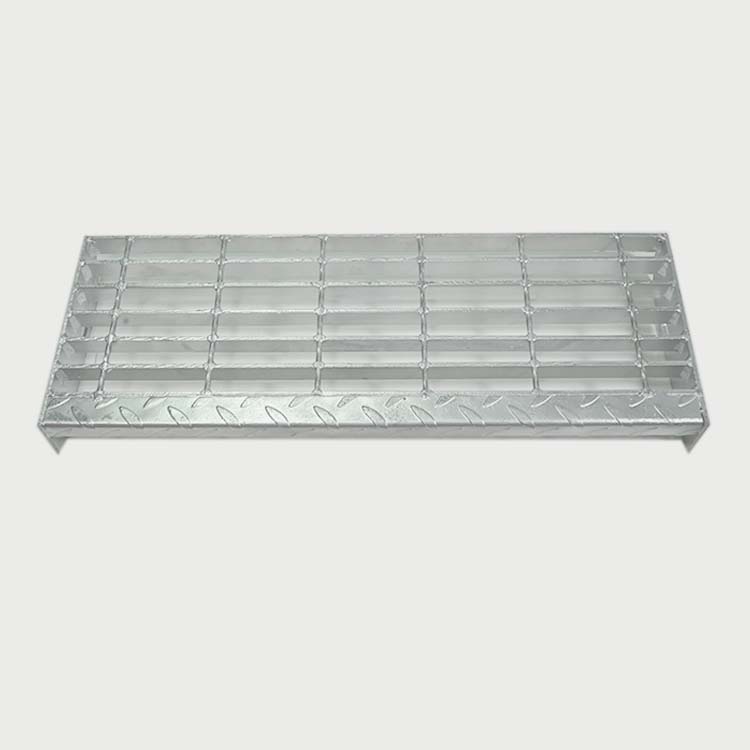 Industrial open-grid steel stair tread with anti-slip surface